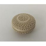 A Victorian carved ivory pill box with leaf decora