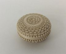 A Victorian carved ivory pill box with leaf decora