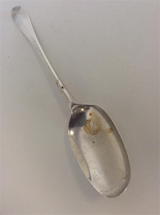 An early Georgian silver rat tail spoon. Punched "