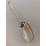 An early Georgian silver rat tail spoon. Punched "