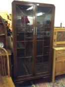 An Art Deco oak display cabinet.