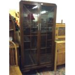 An Art Deco oak display cabinet.