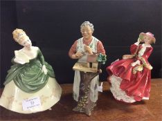 Three Royal Doulton figurines.