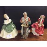 Three Royal Doulton figurines.