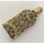 An unusual 18th Century gilt overlaid scent bottle