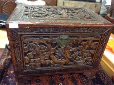 A small camphor wood carved trunk.