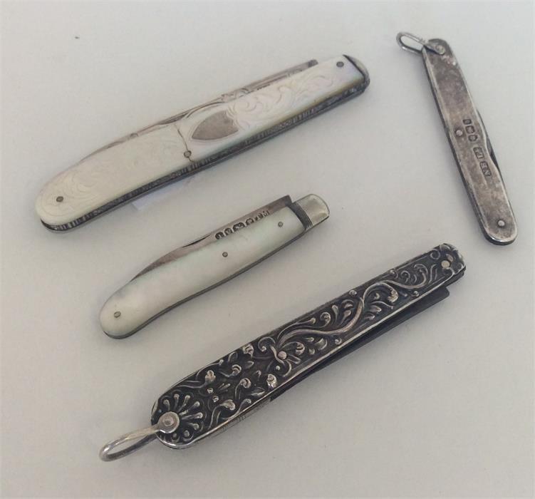 A group of four silver mounted fruit knives with e