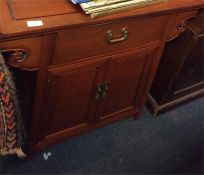 An Oriental single drawer hall table.