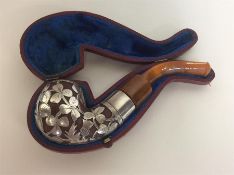 An unusual silver mounted pipe attractively decora