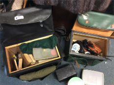 A box containing good fishing reels and accessorie
