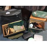 A box containing good fishing reels and accessorie