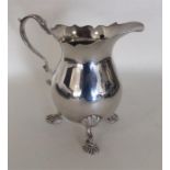 A heavy miniature Georgian style silver cream jug