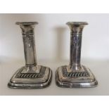 A pair of good silver candlesticks with gadroon de