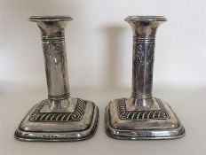 A pair of good silver candlesticks with gadroon de