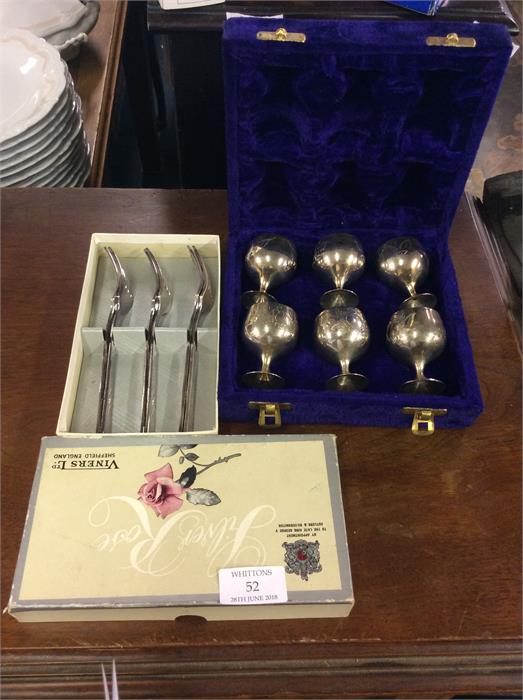 A set of six plated goblets together with some tea