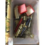 A box containing pens, coins, old keys etc.