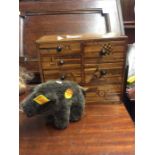 An olive wood chest together with a Steiff bear.