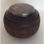 An unusual wooden and silver mounted tea caddy wit