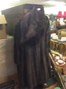 An old fur coat together with a stole.