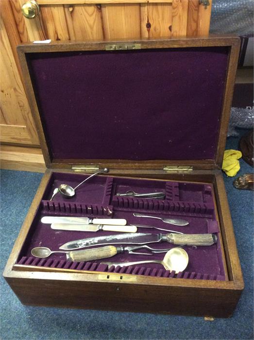An old oak cased cutlery box and contents.