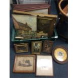 A box of old oil paintings and prints.
