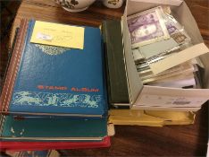 A collection of First Day Covers, stamp albums etc