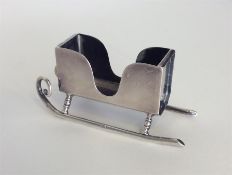 An unusual novelty card holder in the form of a sl