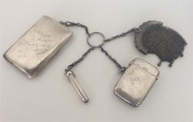 An unusual silver key ring mounted with cigarette