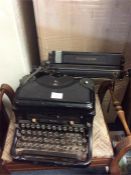 An old typewriter together with a stool.