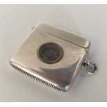 An unusual silver vesta mounted with compass, hing