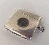 An unusual silver vesta mounted with compass, hing