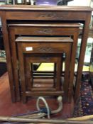 A set of four Oriental carved tables.