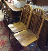 An oak dresser, four chairs and a table.