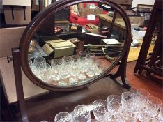 A mahogany toilet mirror.