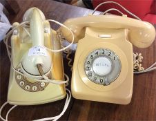 Two Bakelite telephones.