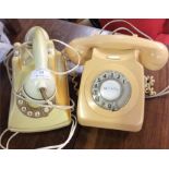 Two Bakelite telephones.