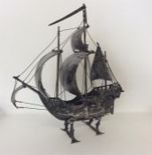 A large heavy Continental silver galleon on stand.