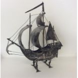 A large heavy Continental silver galleon on stand.