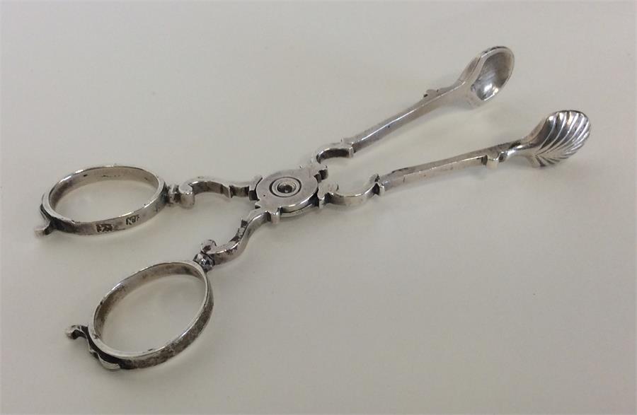 A pair of Georgian silver sugar scissors of typica