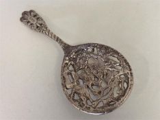 A Continental pierced silver caddy spoon decorated