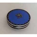 A stylish silver and enamelled box with central fl