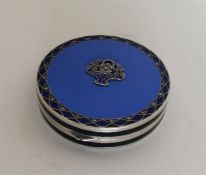 A stylish silver and enamelled box with central fl