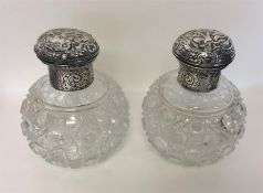 A pair of hobnail cut and silver mounted scent bot