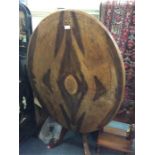 An Edwardian walnut inlaid pedestal table.