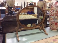 A mahogany toilet mirror.