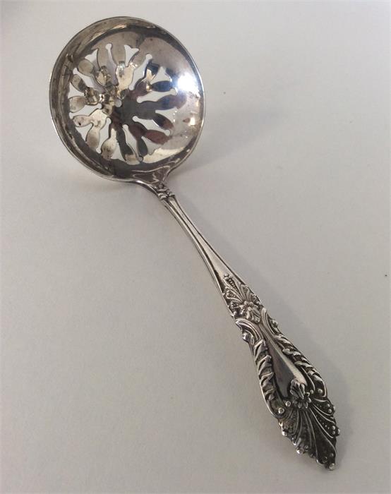 An attractive silver Edwardian sifter spoon decora