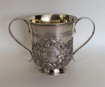 A good Georgian chased two handled loving cup deco