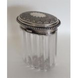 A good quality oval silver hinged top dressing tab
