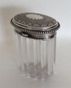 A good quality oval silver hinged top dressing tab