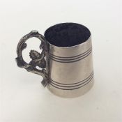A small Continental silver tapering cup with reede
